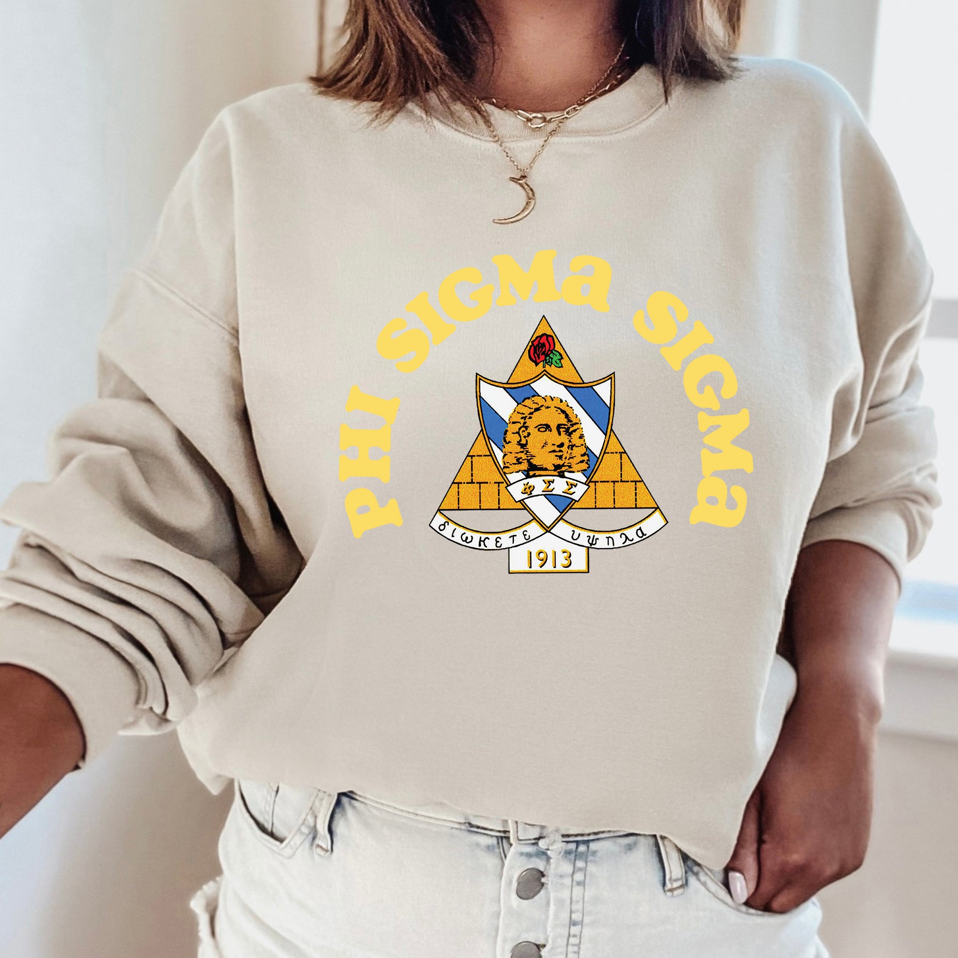 a woman wearing a sweatshirt with a picture of a woman's face on it