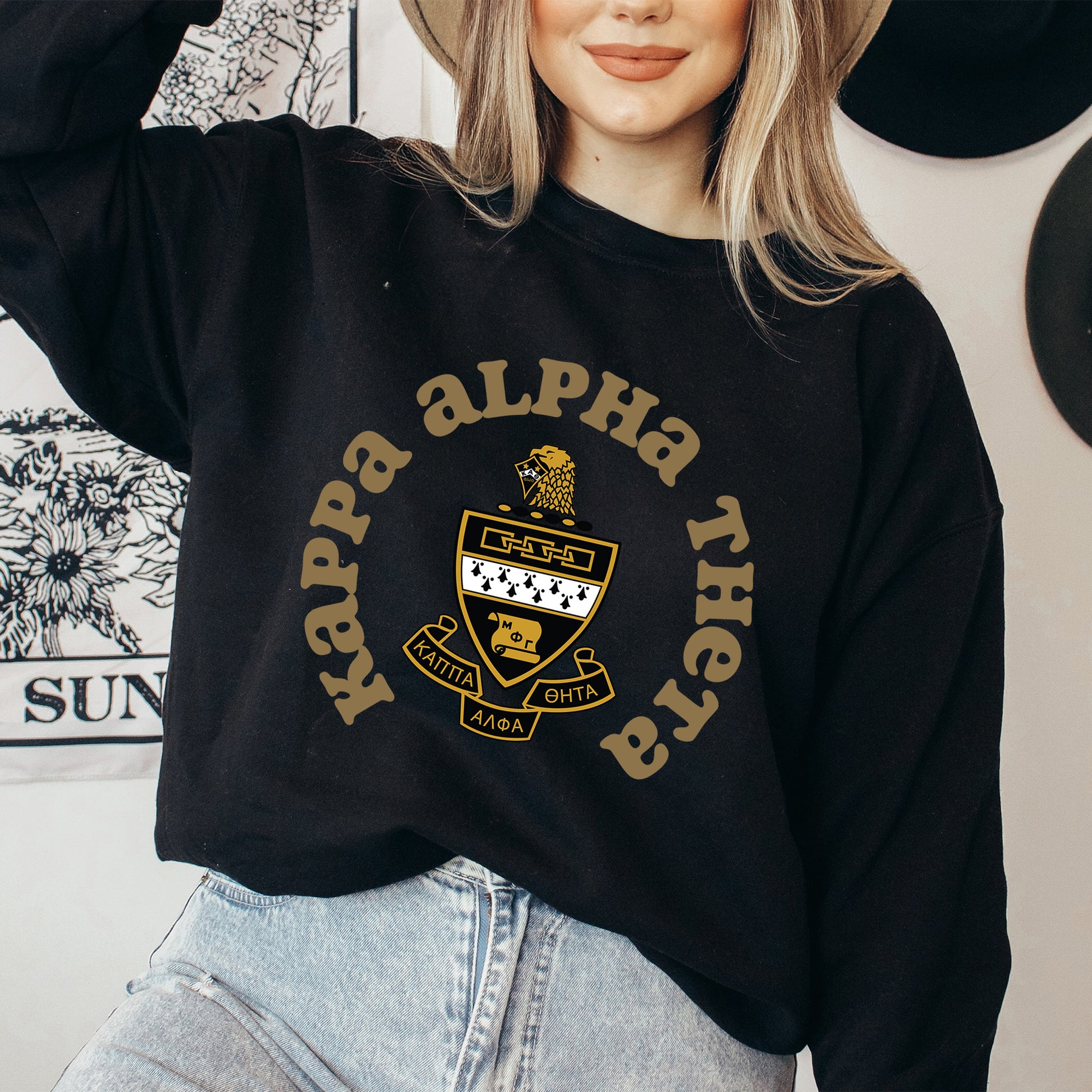 a woman wearing a hat and a black sweatshirt