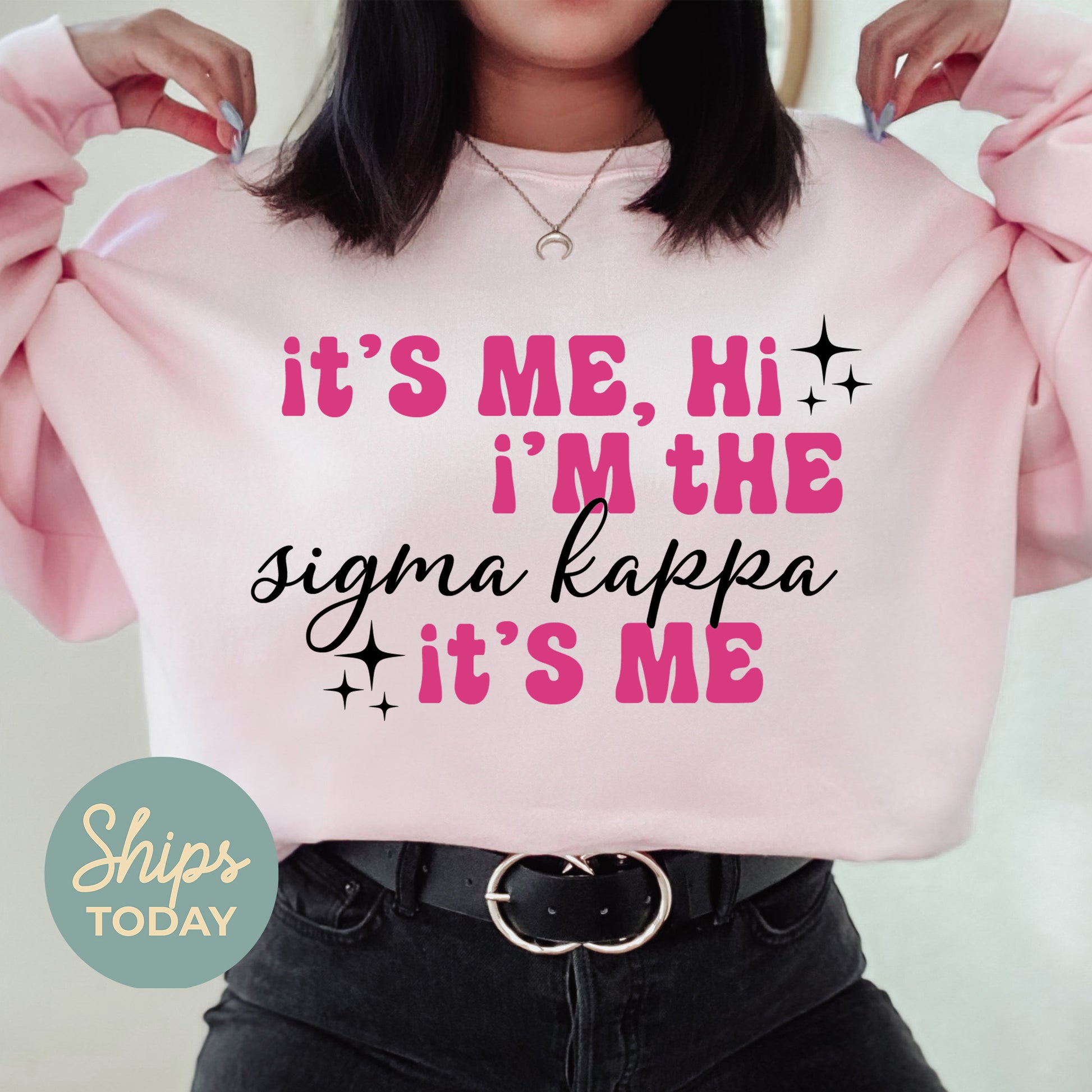 a woman wearing a pink sweatshirt that says it's me, i'm
