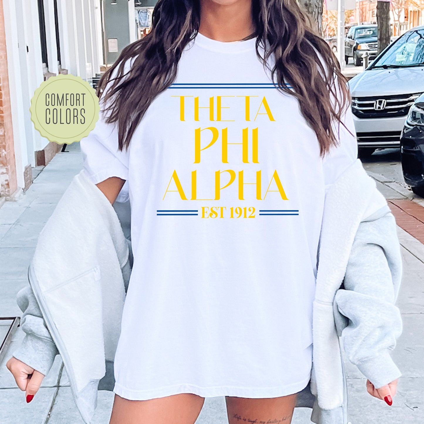a woman wearing a t - shirt that says the a phi phi phi phi phi