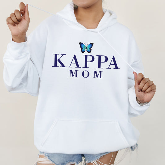 a woman wearing a white hoodie with a butterfly on it