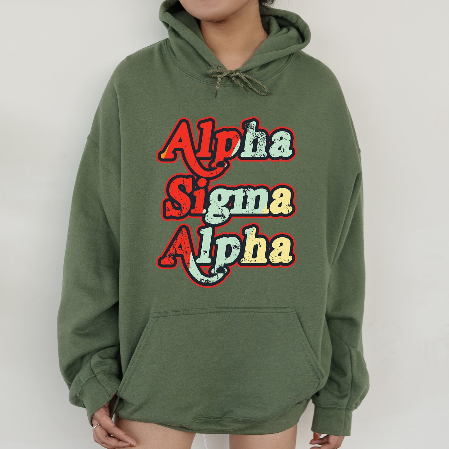 a person wearing a green hoodie with the words aloha and aloh