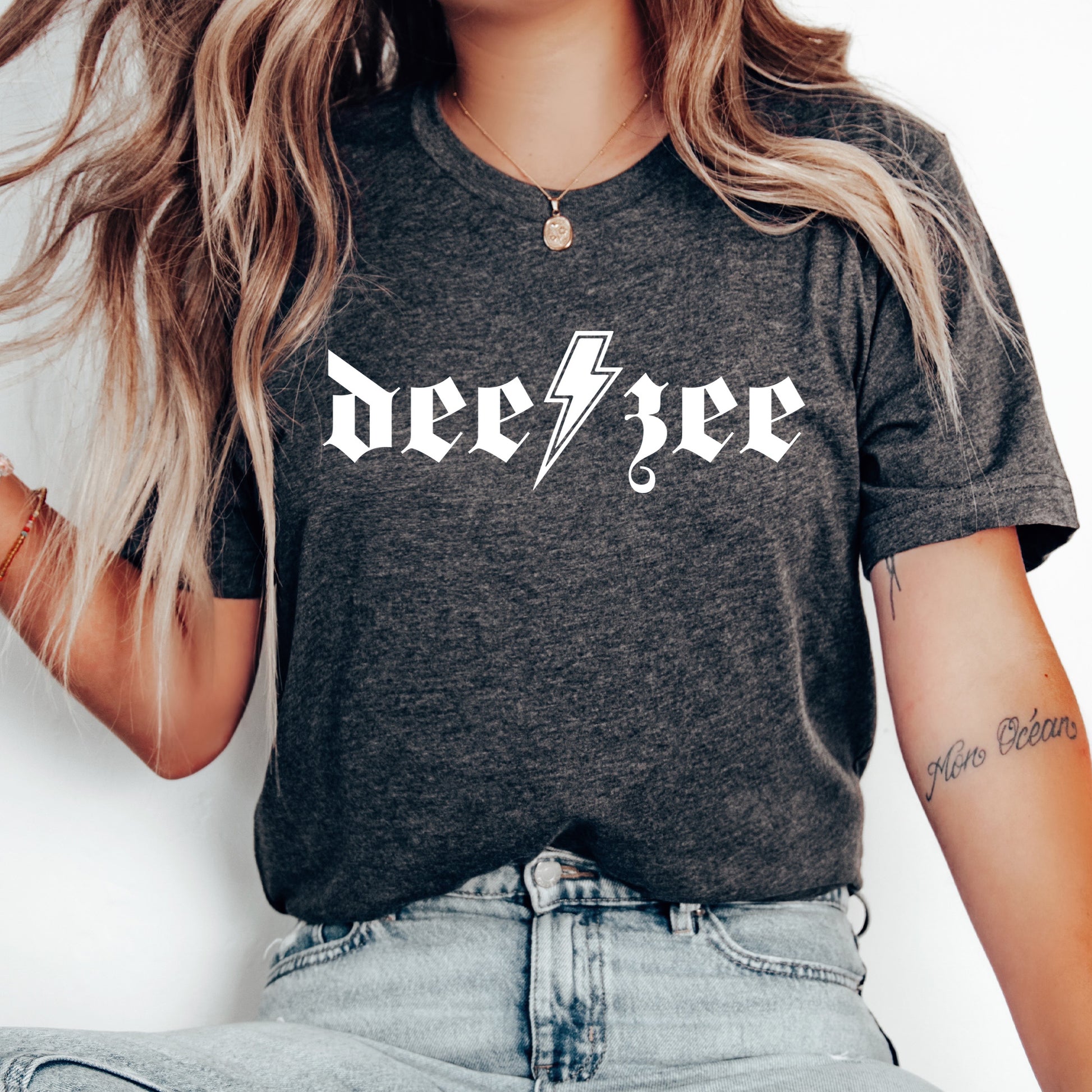 a woman wearing a black tee shirt with a lightning bolt on it