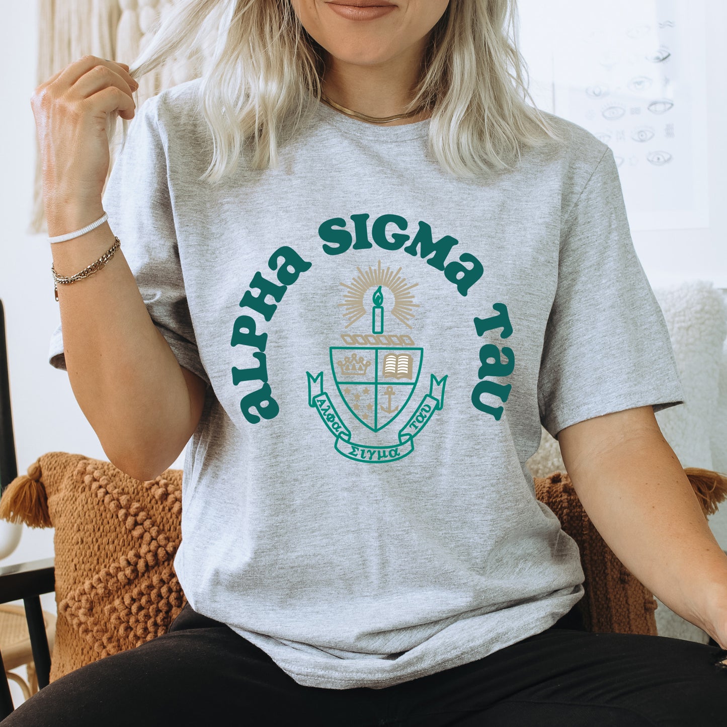 a woman sitting in a chair with a shirt on
