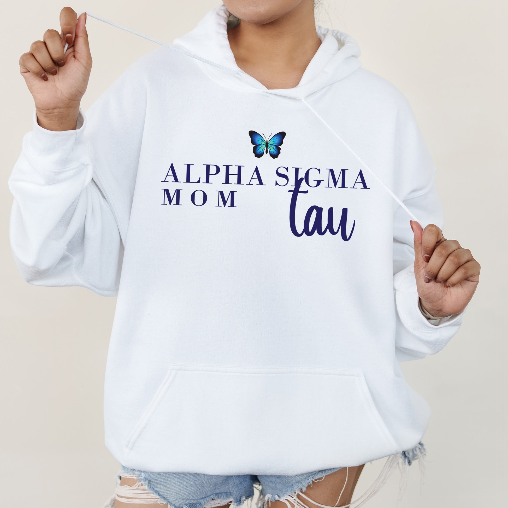 a woman wearing a white hoodie with a butterfly on it