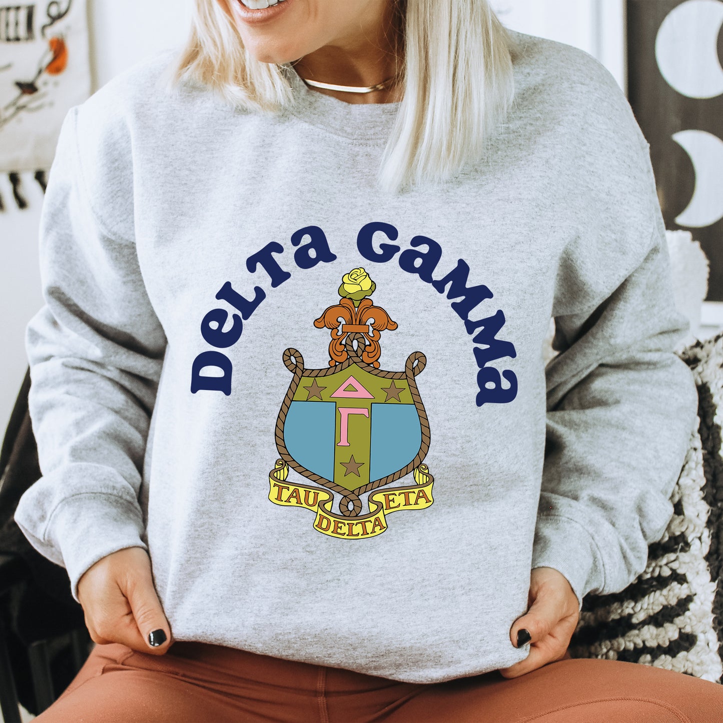 a woman wearing a sweatshirt that says delta gaming