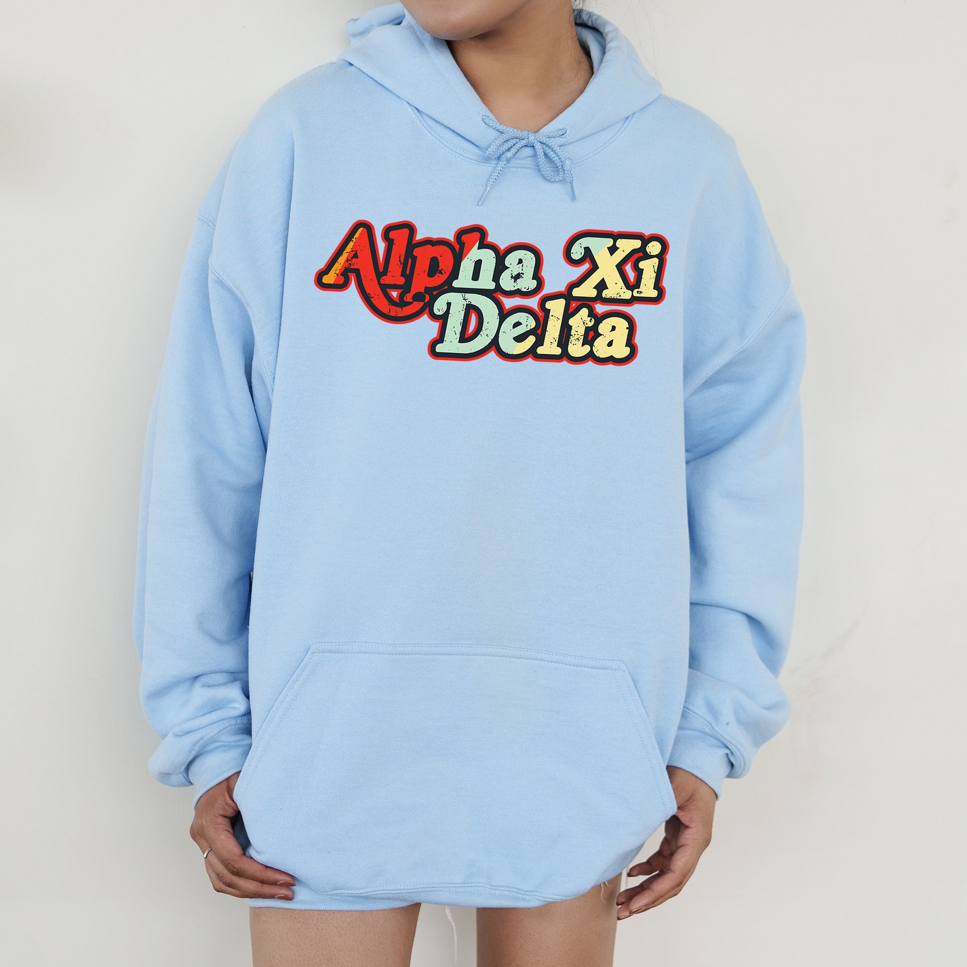 a person wearing a blue hoodie that says apa delta