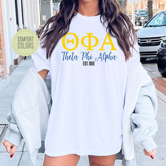 a woman wearing a white shirt with yellow letters on it