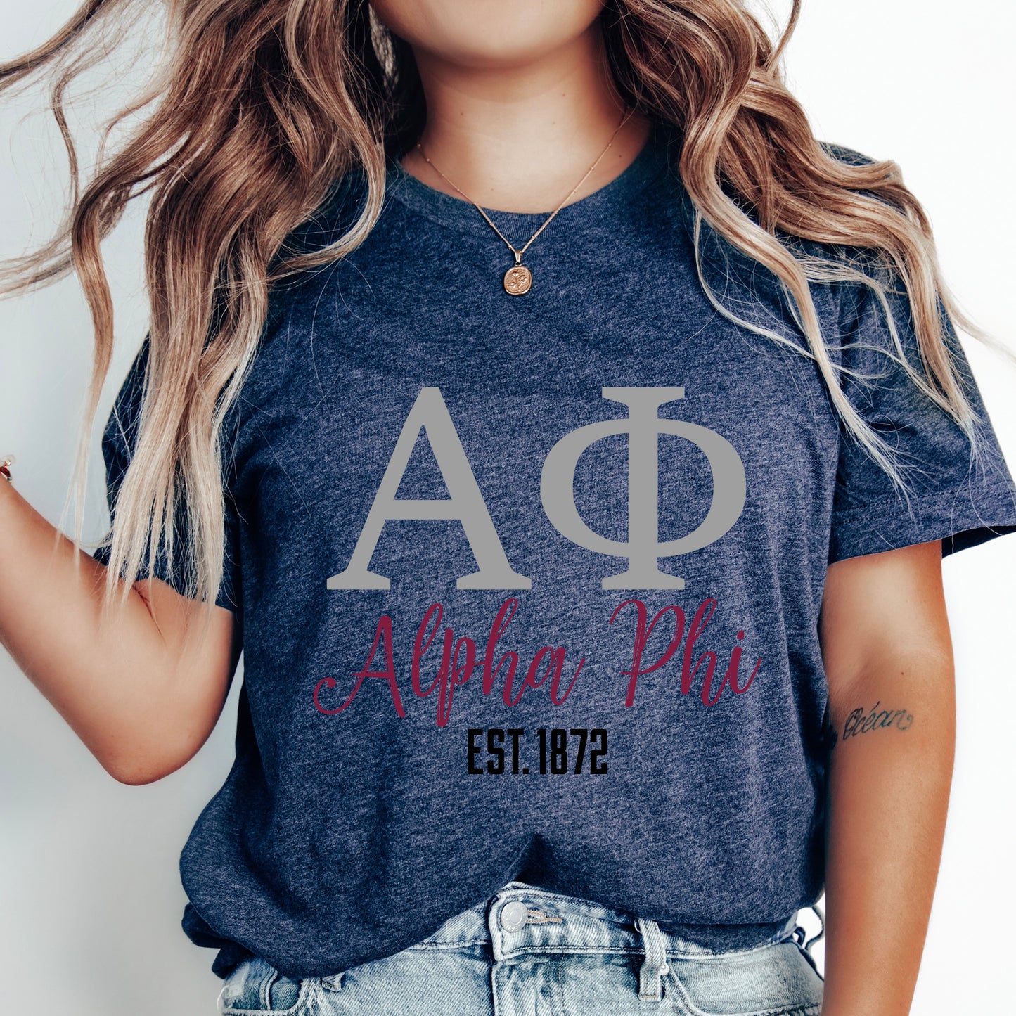 a woman wearing a t - shirt with the letters ap on it