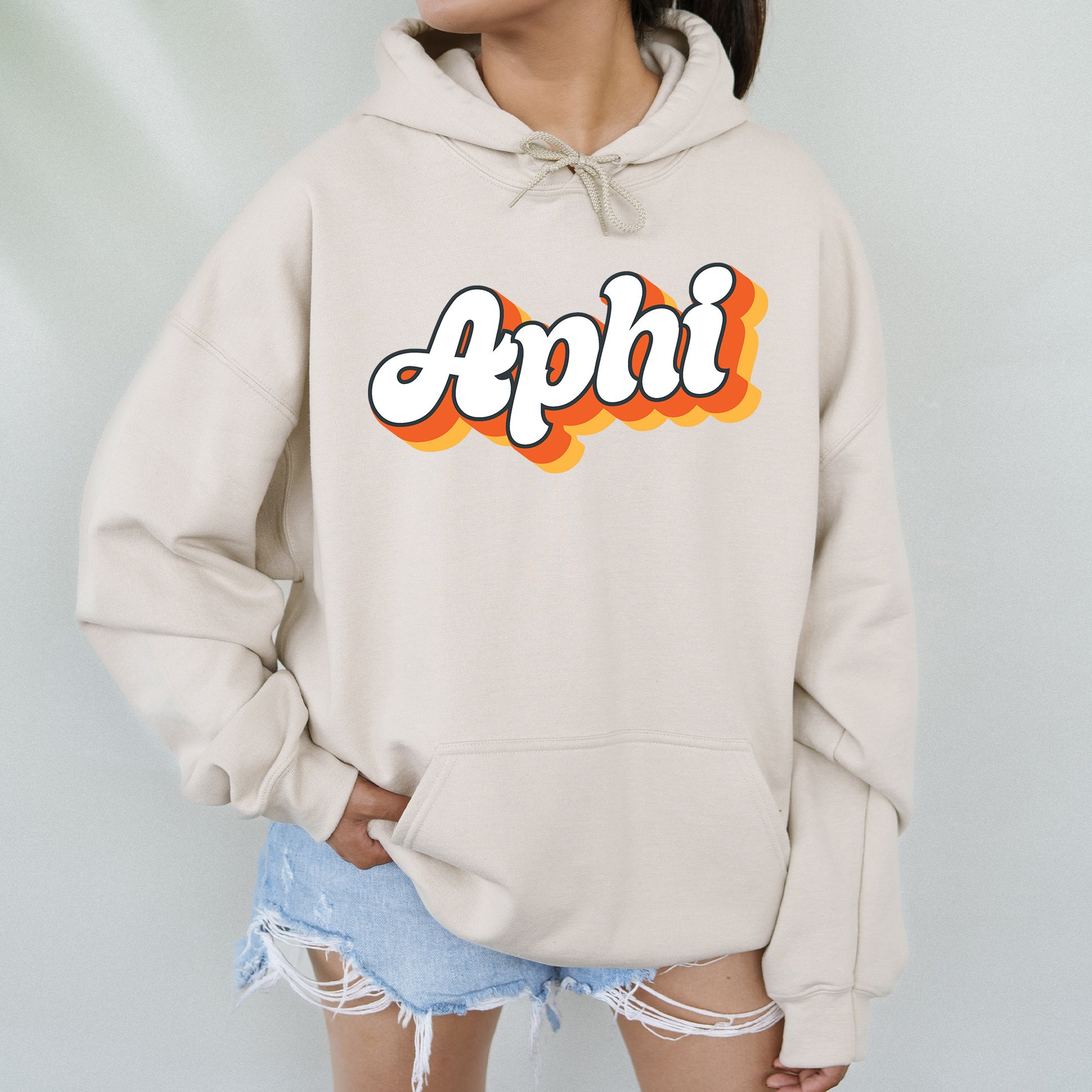 a woman wearing a sweatshirt with the word appli on it