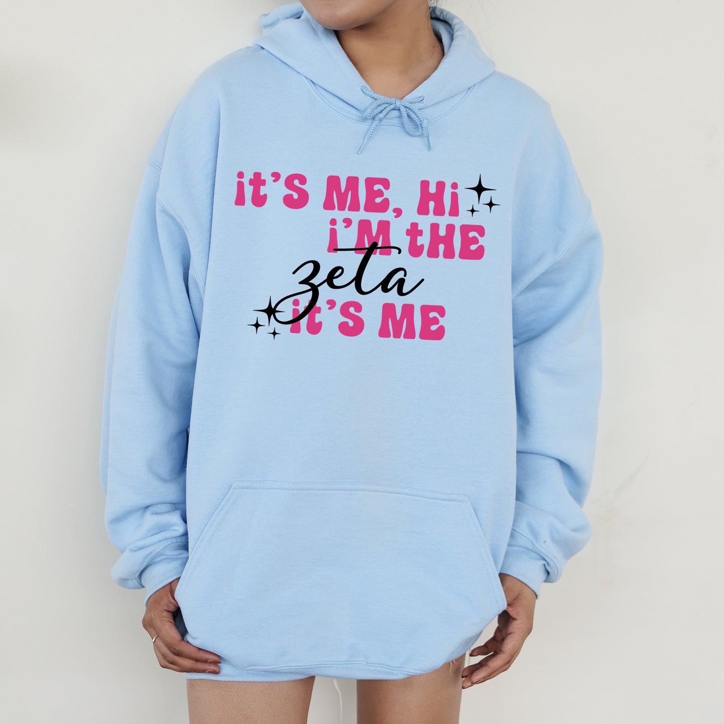 a person wearing a blue hoodie that says it's me, i '