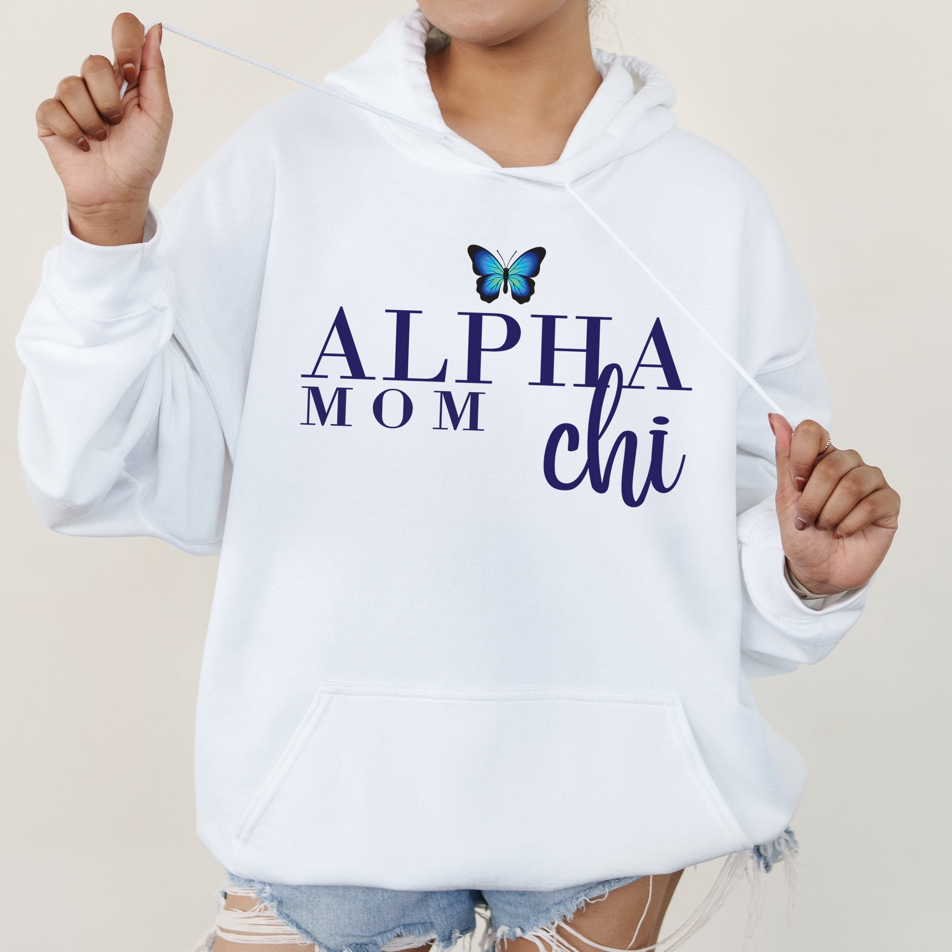 a woman wearing a white hoodie with a butterfly on it