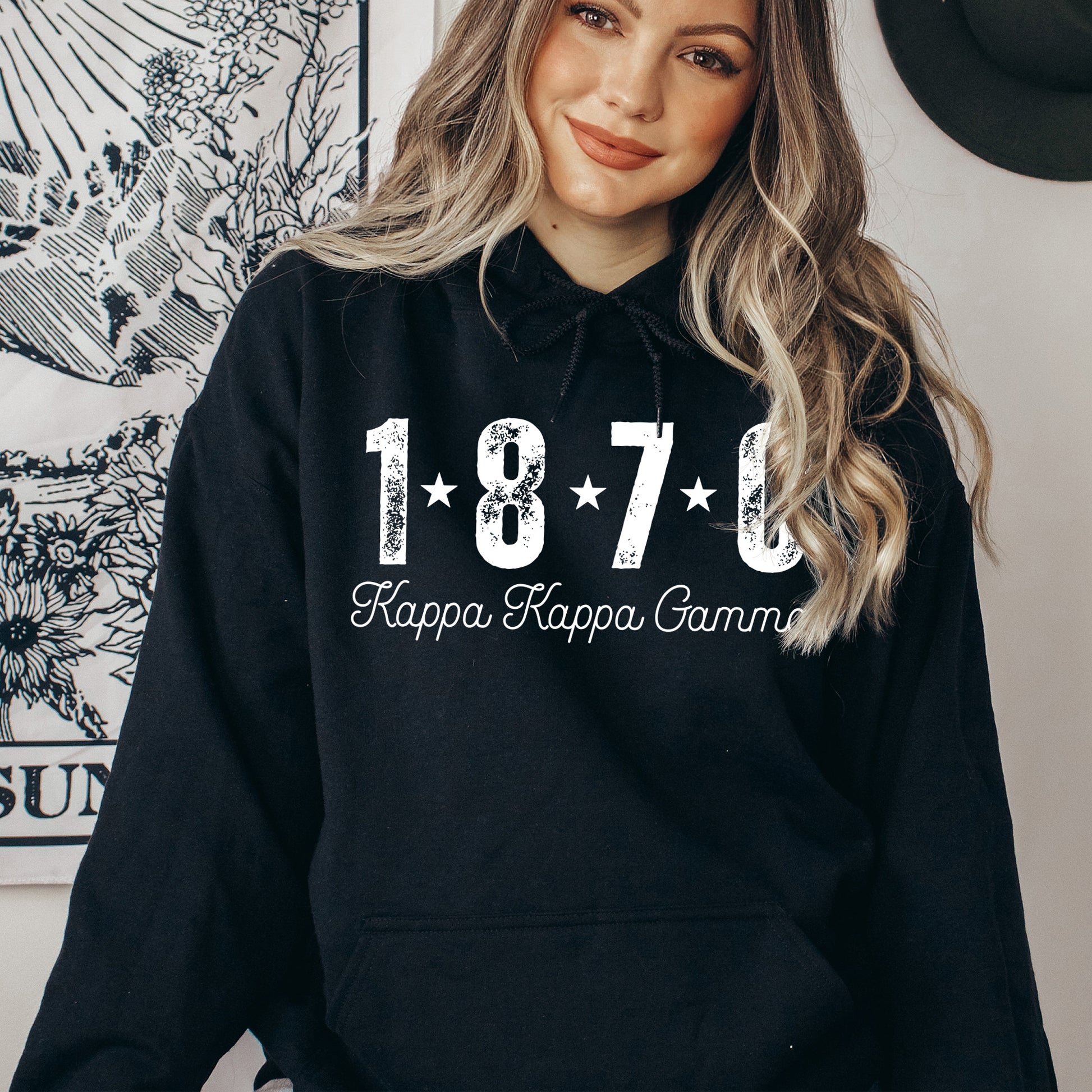 a woman wearing a black hoodie with the year 1970 printed on it