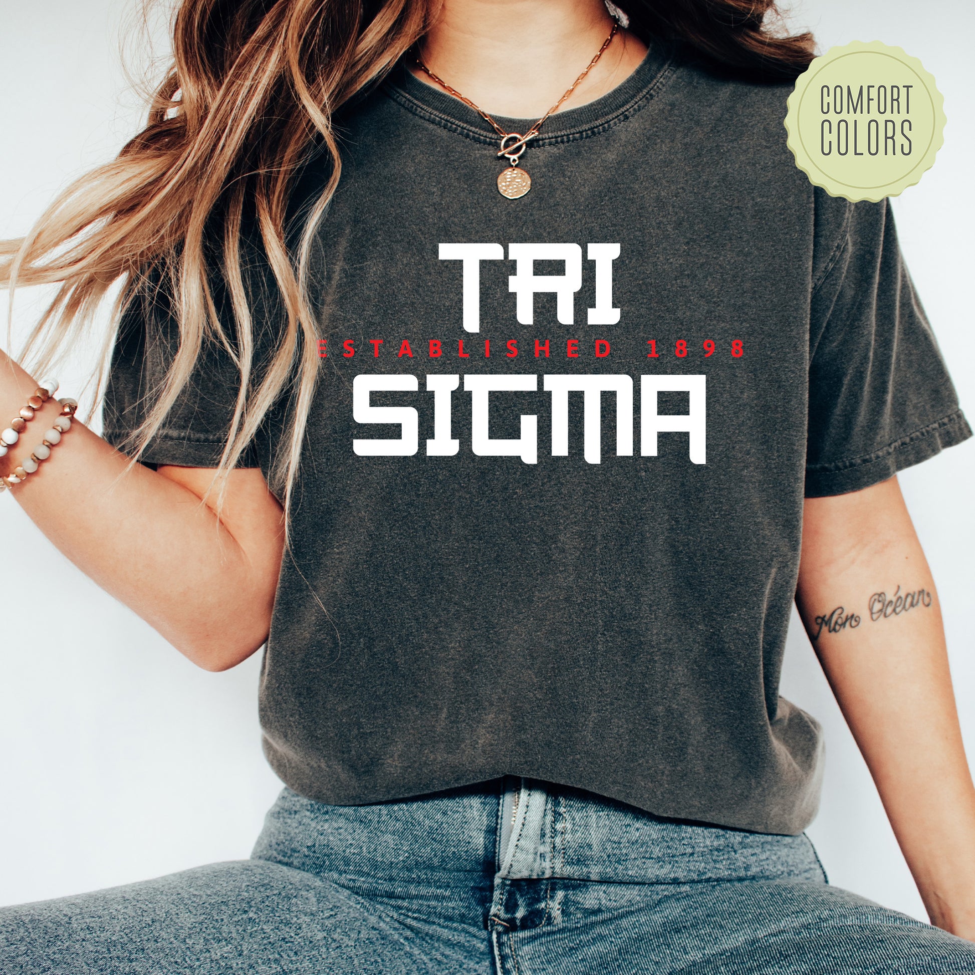 a woman wearing a t - shirt with the word stigma printed on it