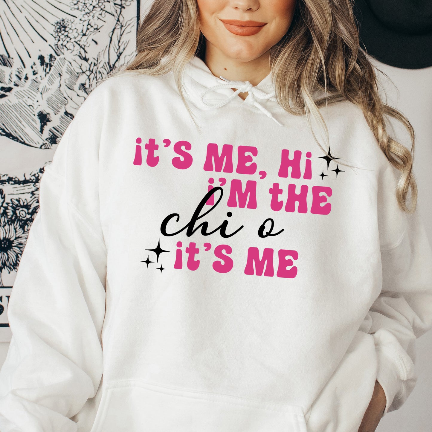 a woman wearing a white hoodie that says it's me, i '