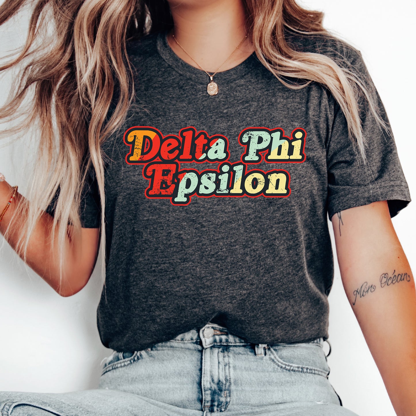 a woman wearing a shirt that says delta phi epiloon