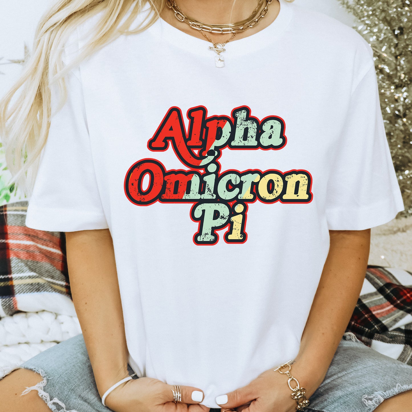 a woman wearing a white t - shirt with the words alpha on it