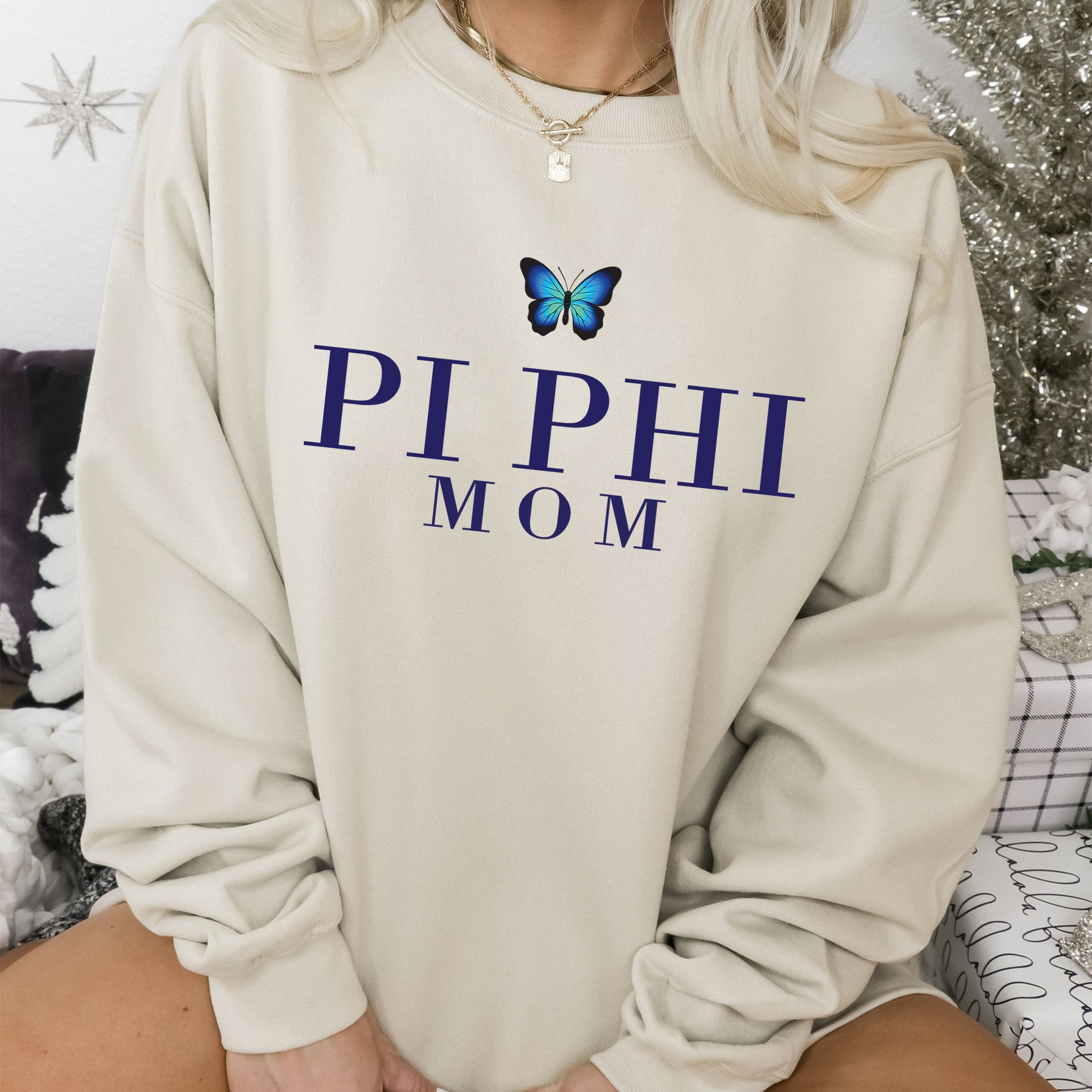 a woman wearing a sweatshirt with a butterfly on it