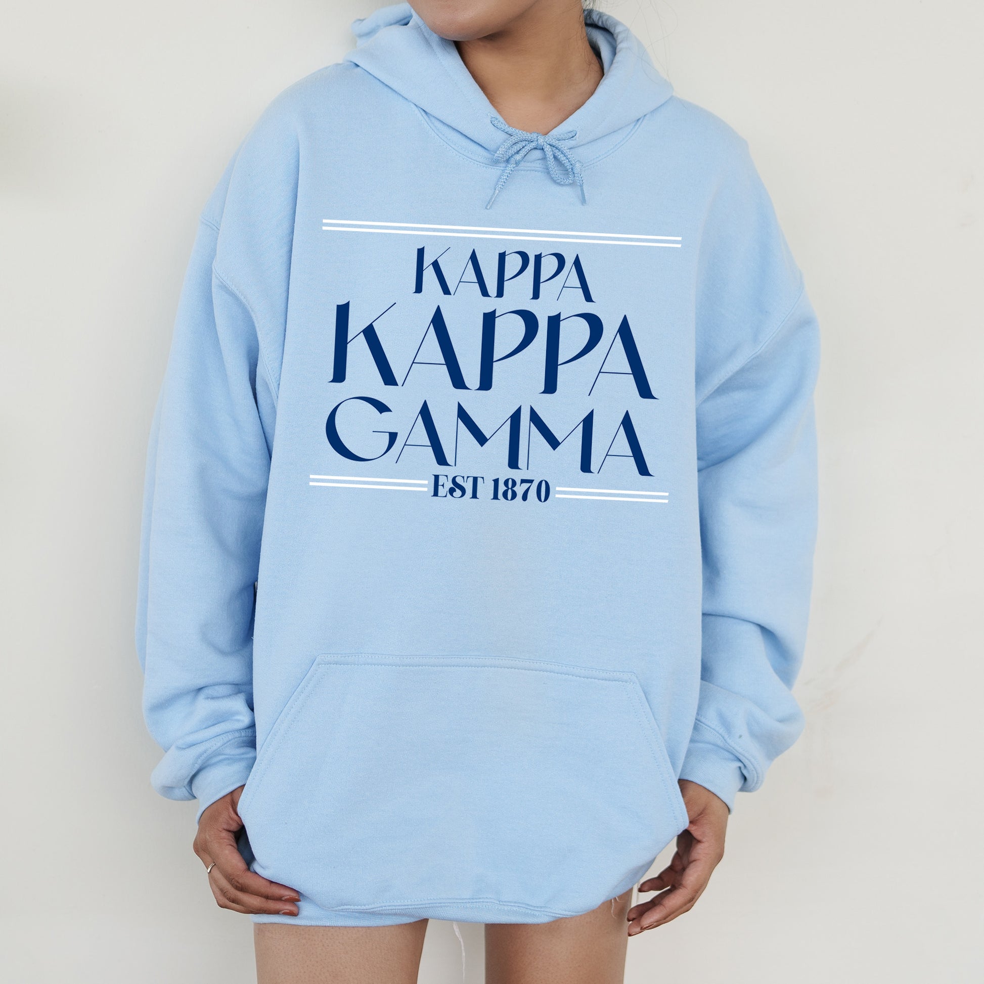 a person wearing a blue hoodie that says kappa kappa ga