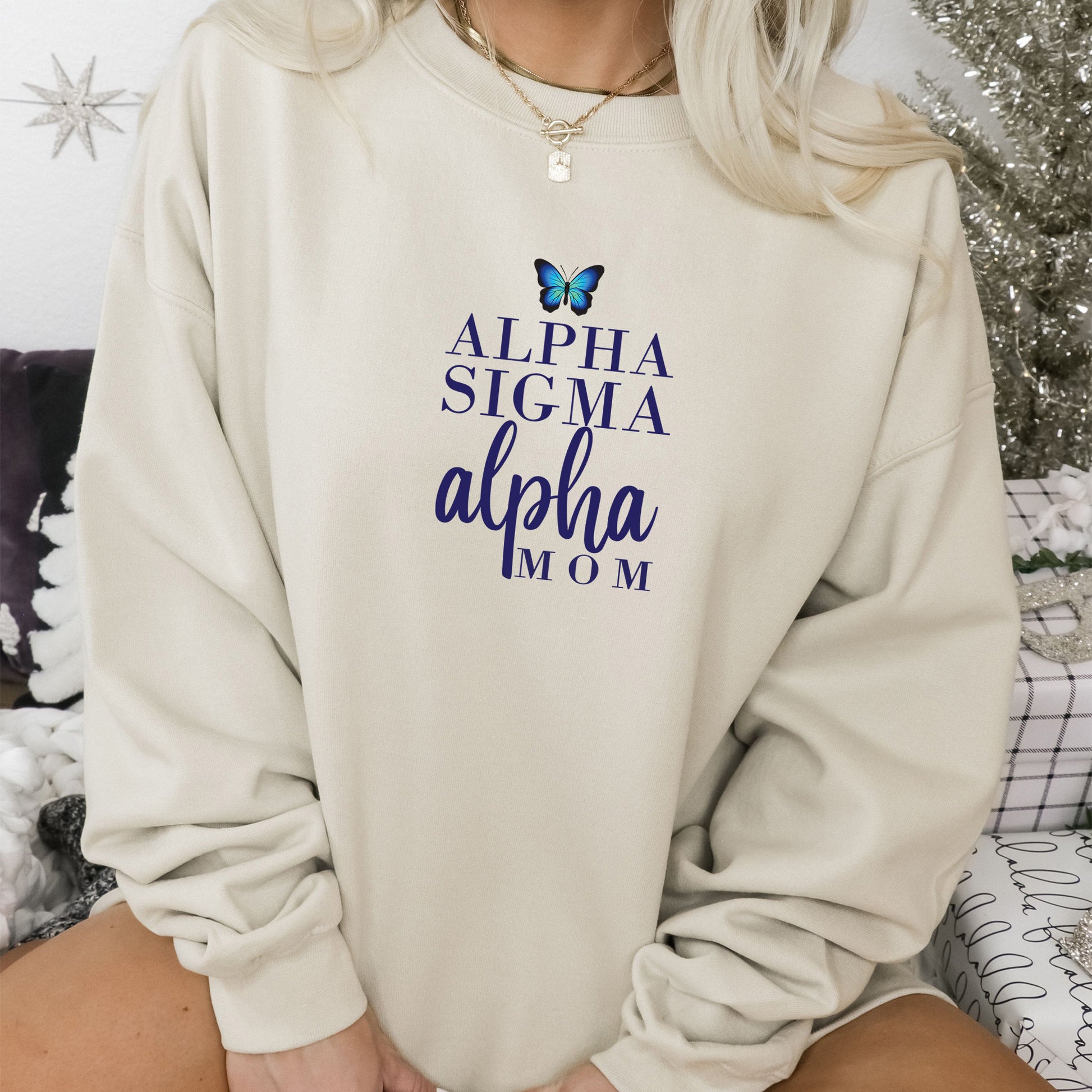 a woman wearing a sweatshirt with a butterfly on it