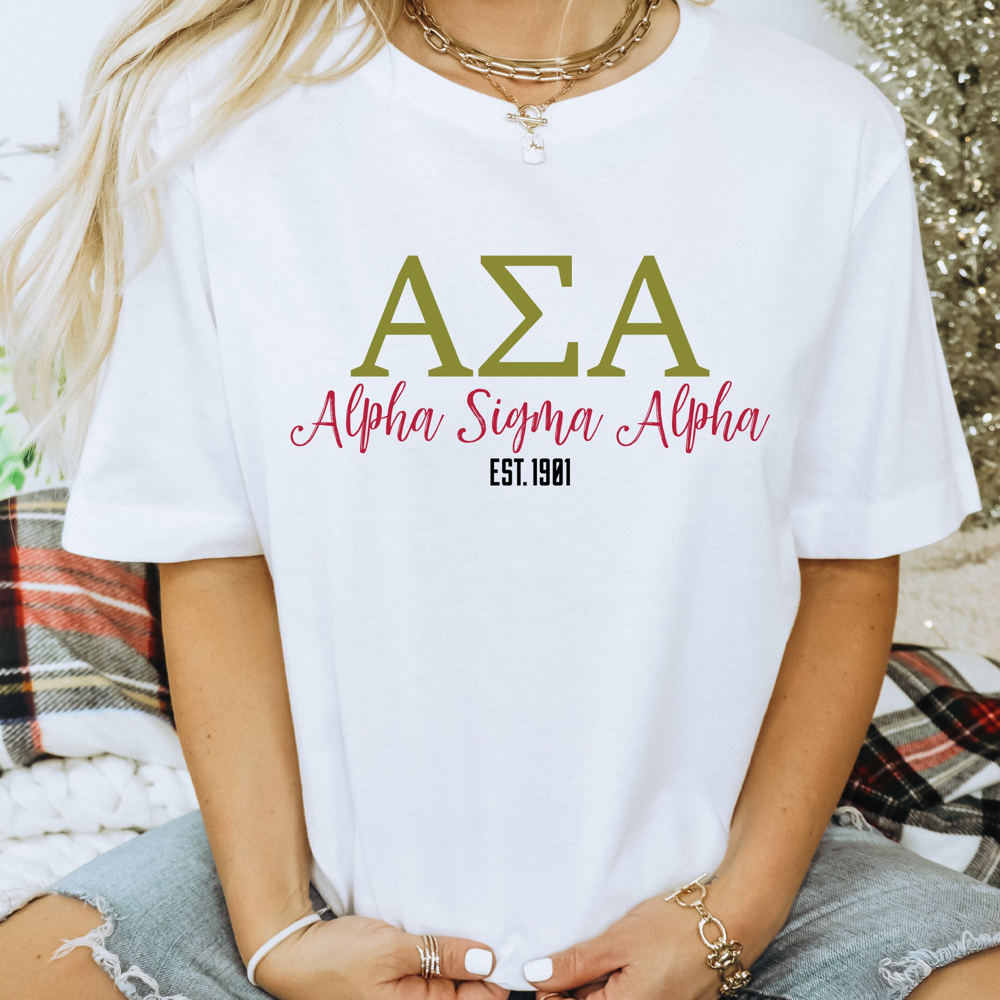 a woman wearing a white t - shirt with the word aza on it