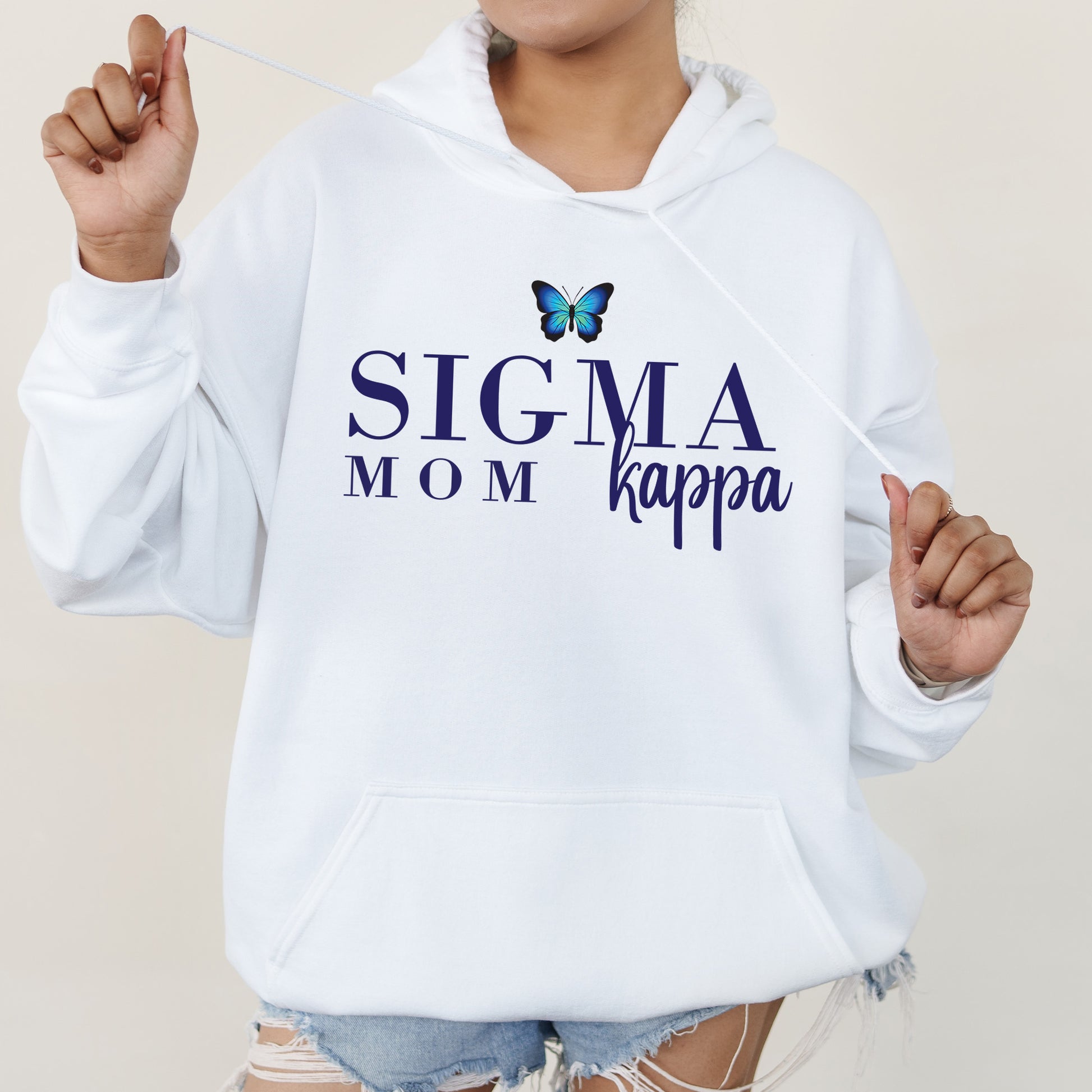 a woman wearing a white sweatshirt with a butterfly on it
