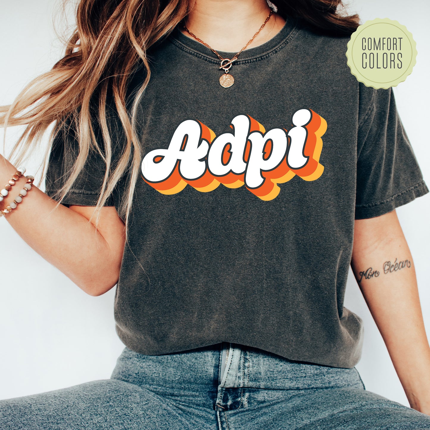 a woman wearing a t - shirt with the word adpi printed on it