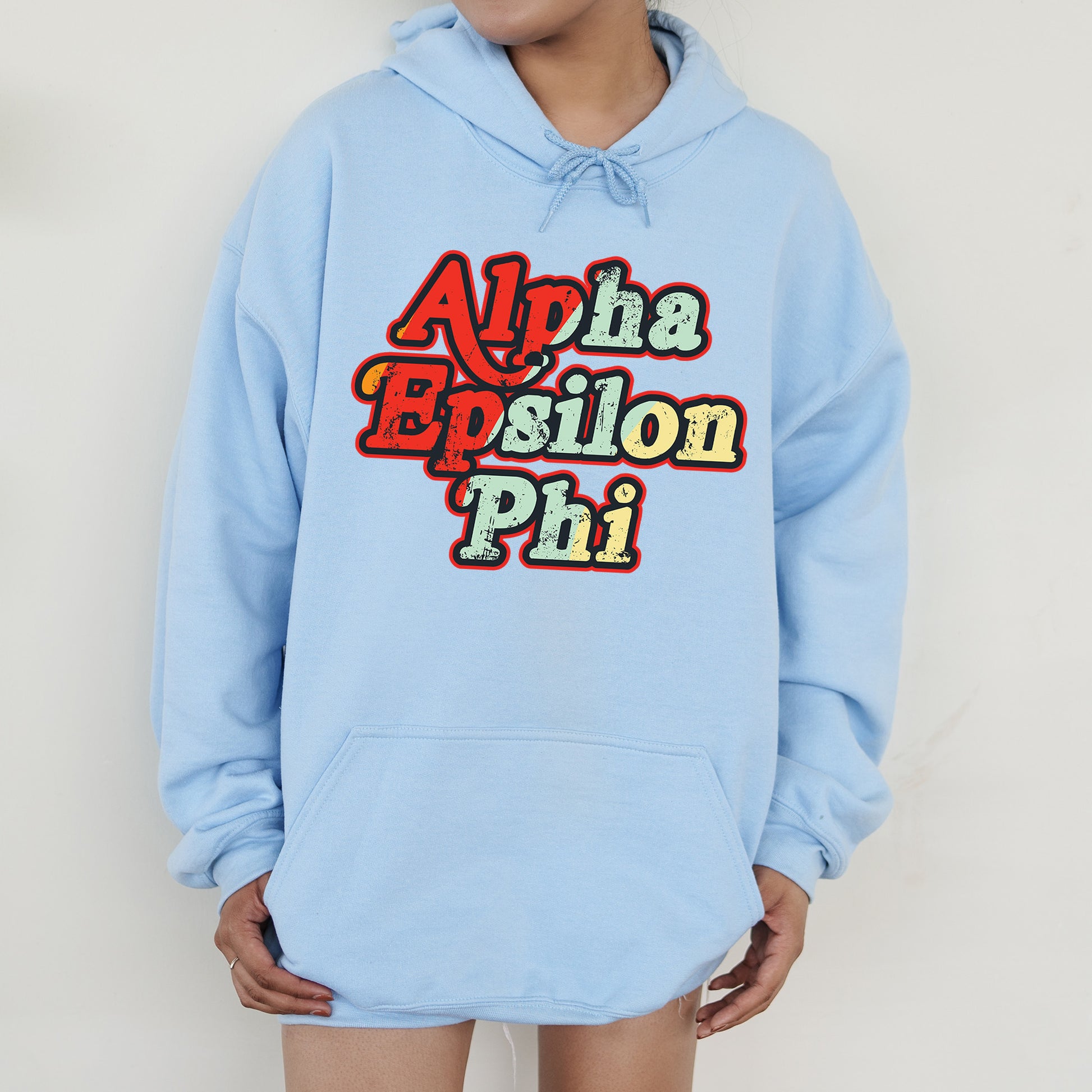 a person wearing a blue hoodie with the words aloha epsilon