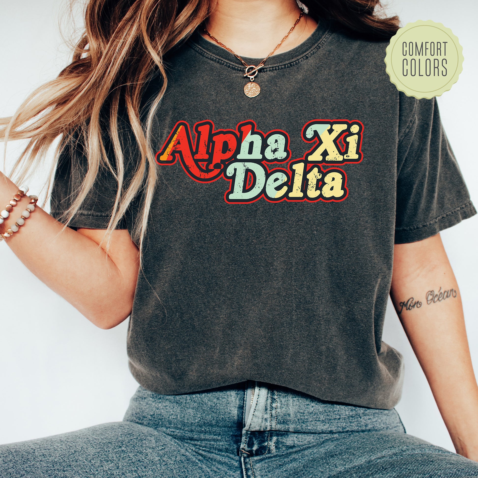 a woman wearing a black shirt that says apha xi delta