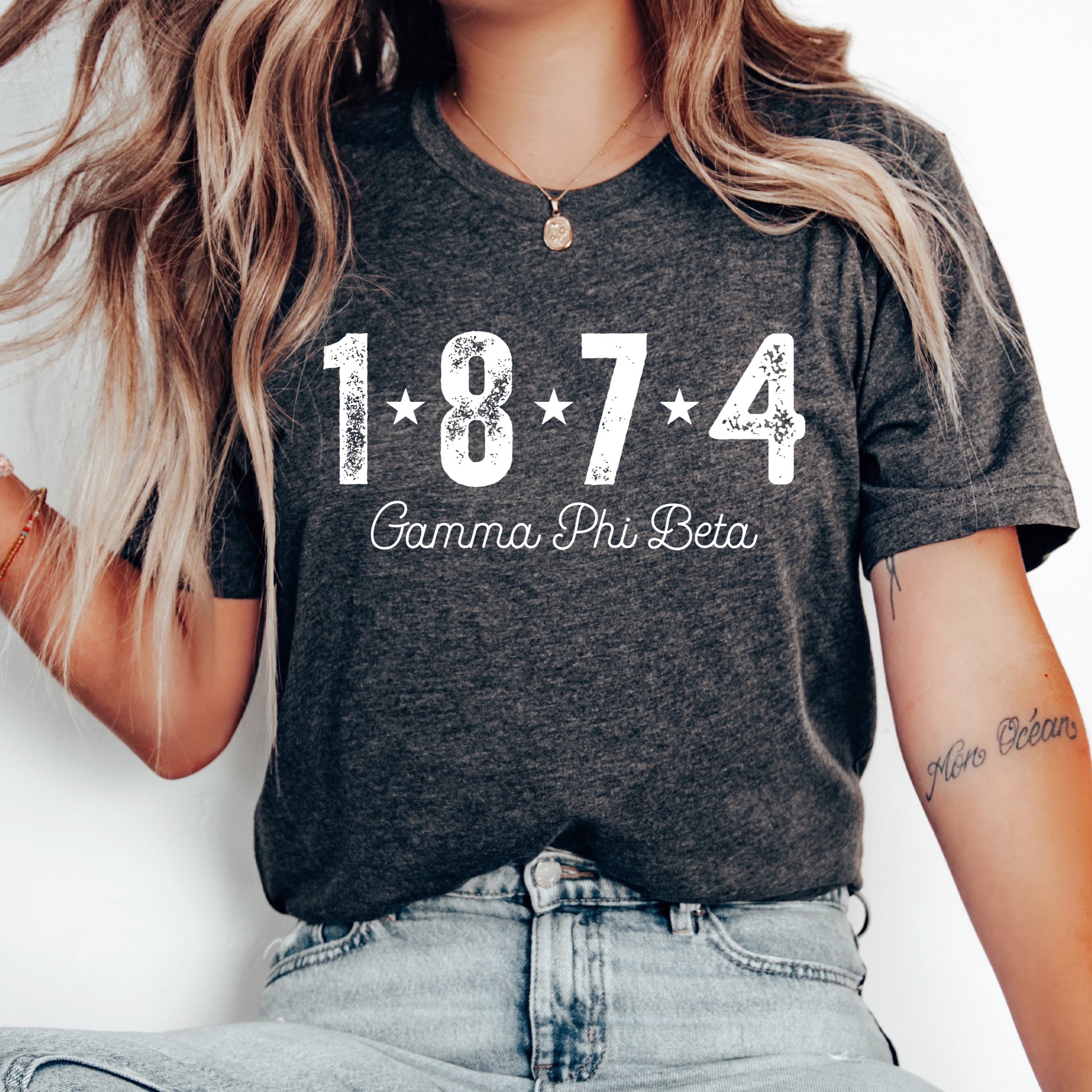 a woman wearing a t - shirt with the number of her birth printed on it