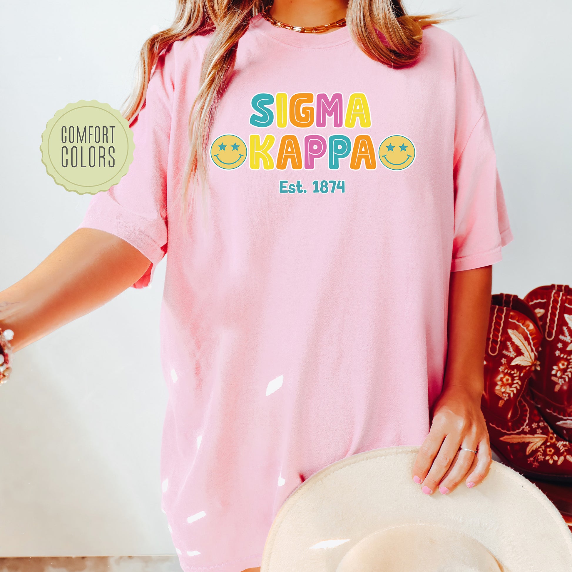 a woman wearing a pink shirt and hat