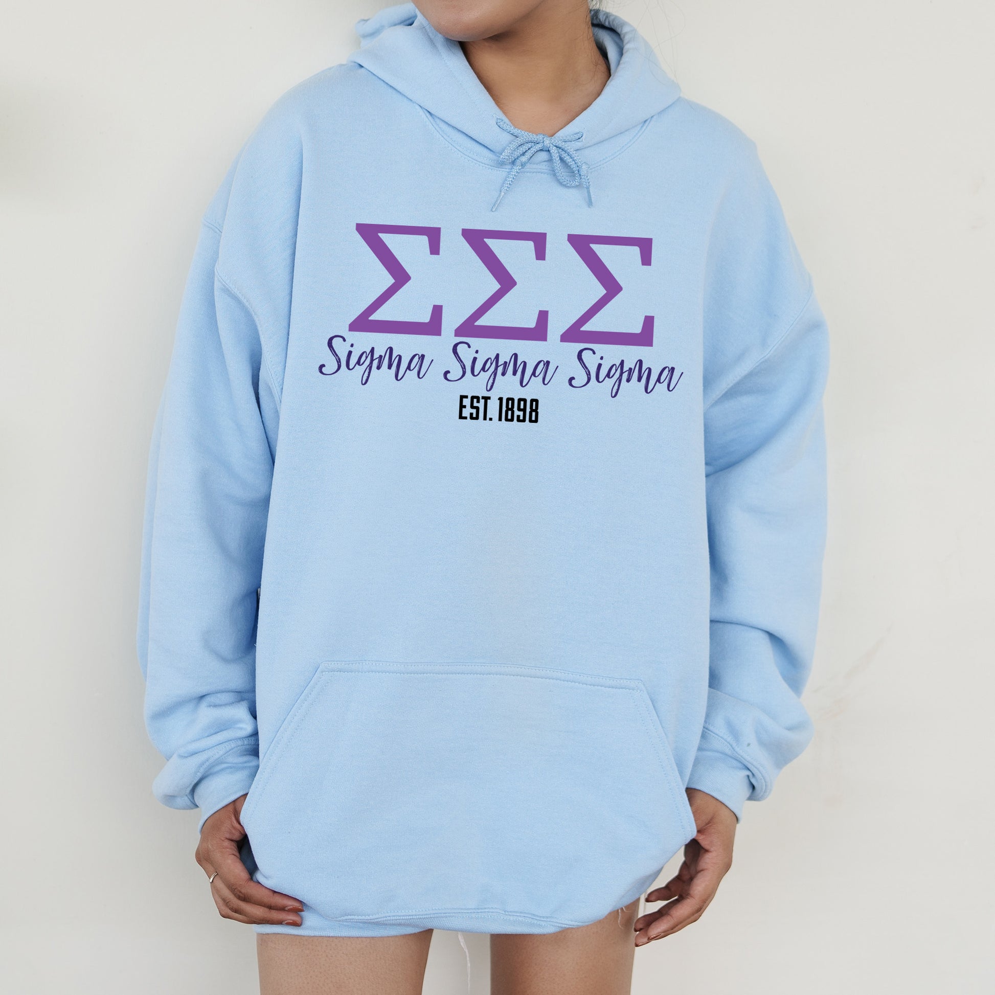a person wearing a blue hoodie with the number 532 on it
