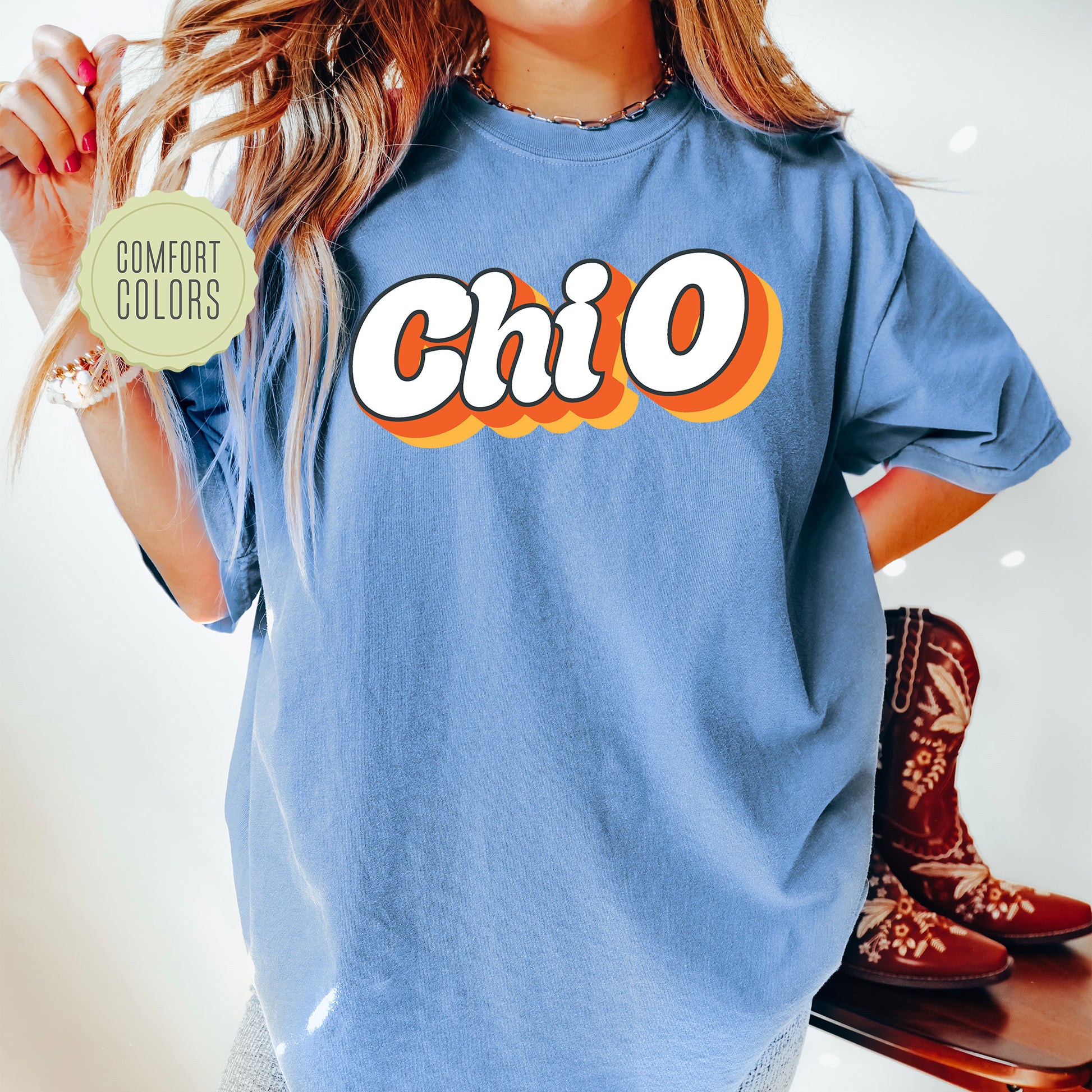 a woman wearing a blue shirt with the word chicago on it