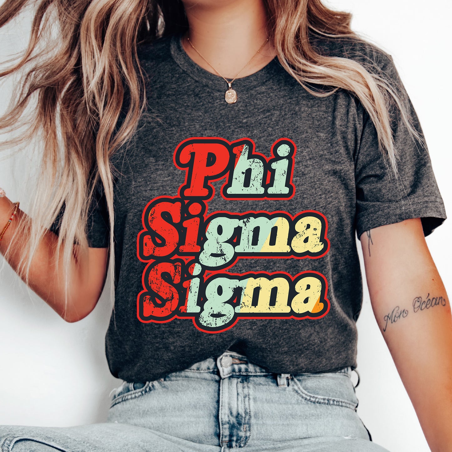 a woman with long hair wearing a phi sigma shirt