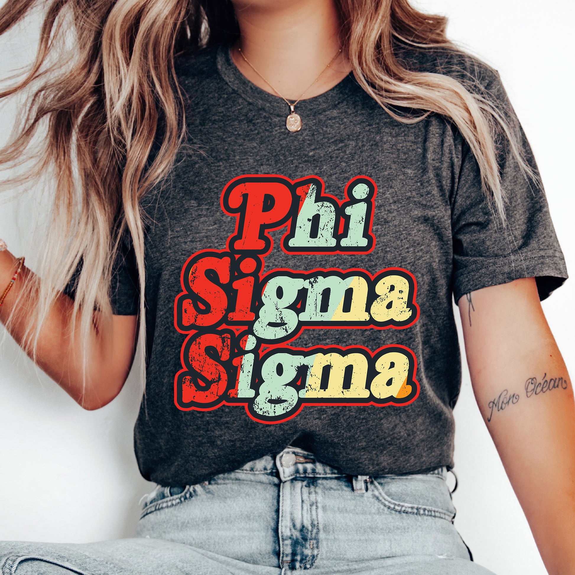 a woman with long hair wearing a phi sigma shirt