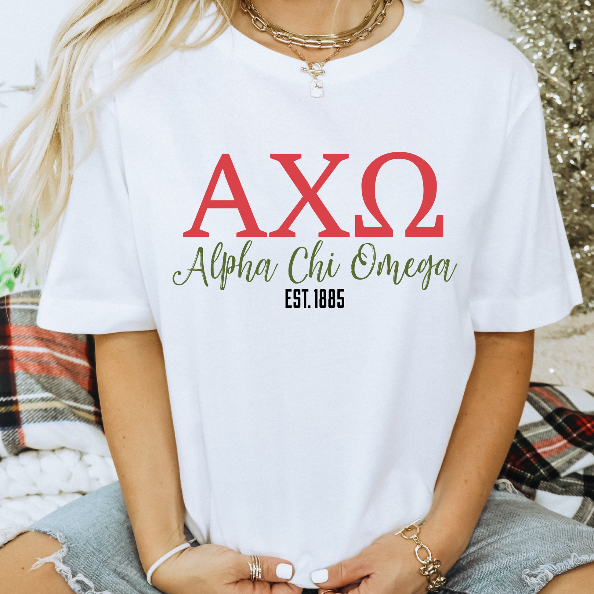 a woman wearing a white t - shirt with the word ax2 on it