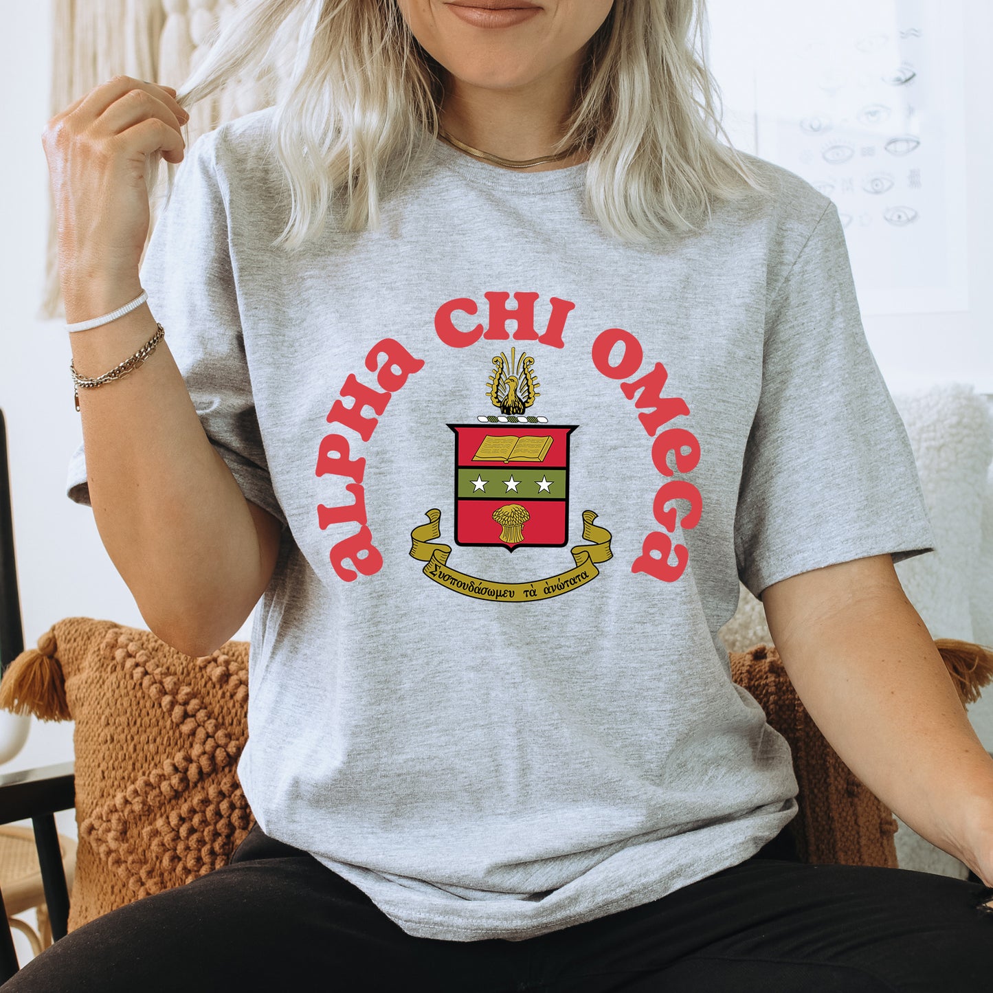 a woman sitting in a chair with a shirt on