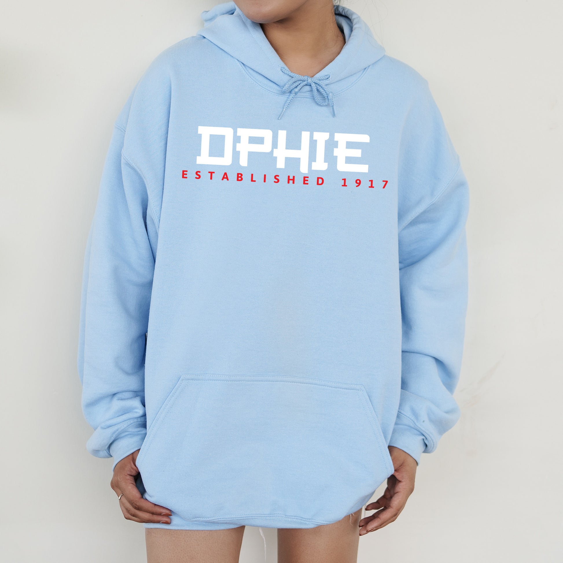 a person wearing a blue hoodie with the word ophe on it