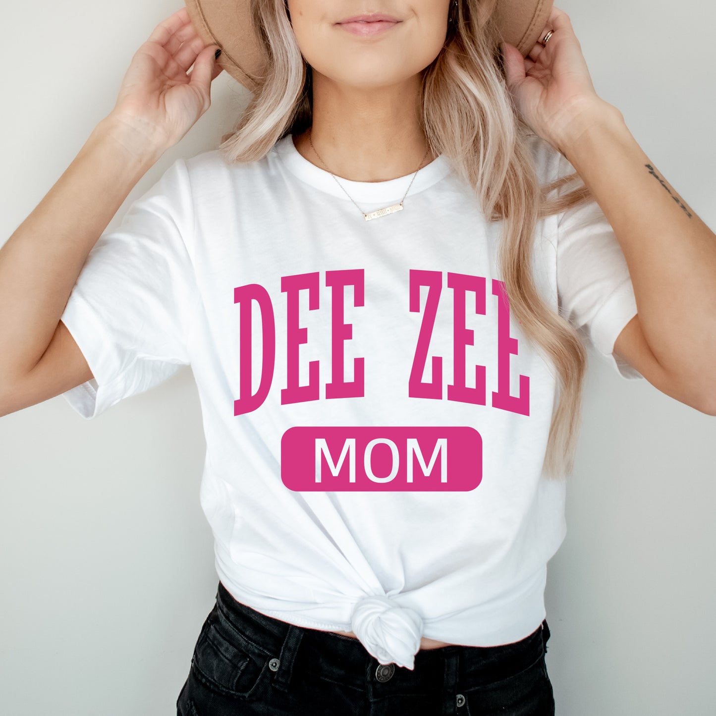 a woman wearing a hat and a tee shirt