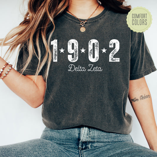 a woman wearing a t - shirt with the number 1920 written on it