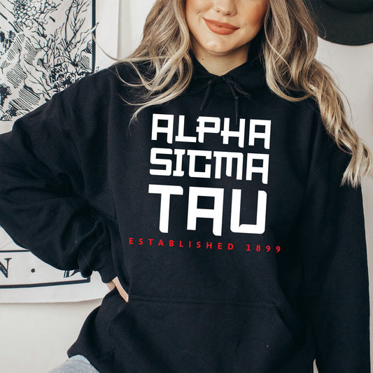 a woman wearing a black hoodie with white letters
