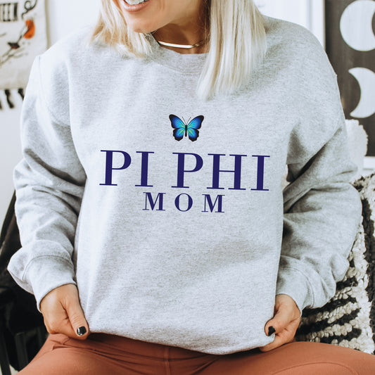 a woman wearing a sweatshirt with a butterfly on it