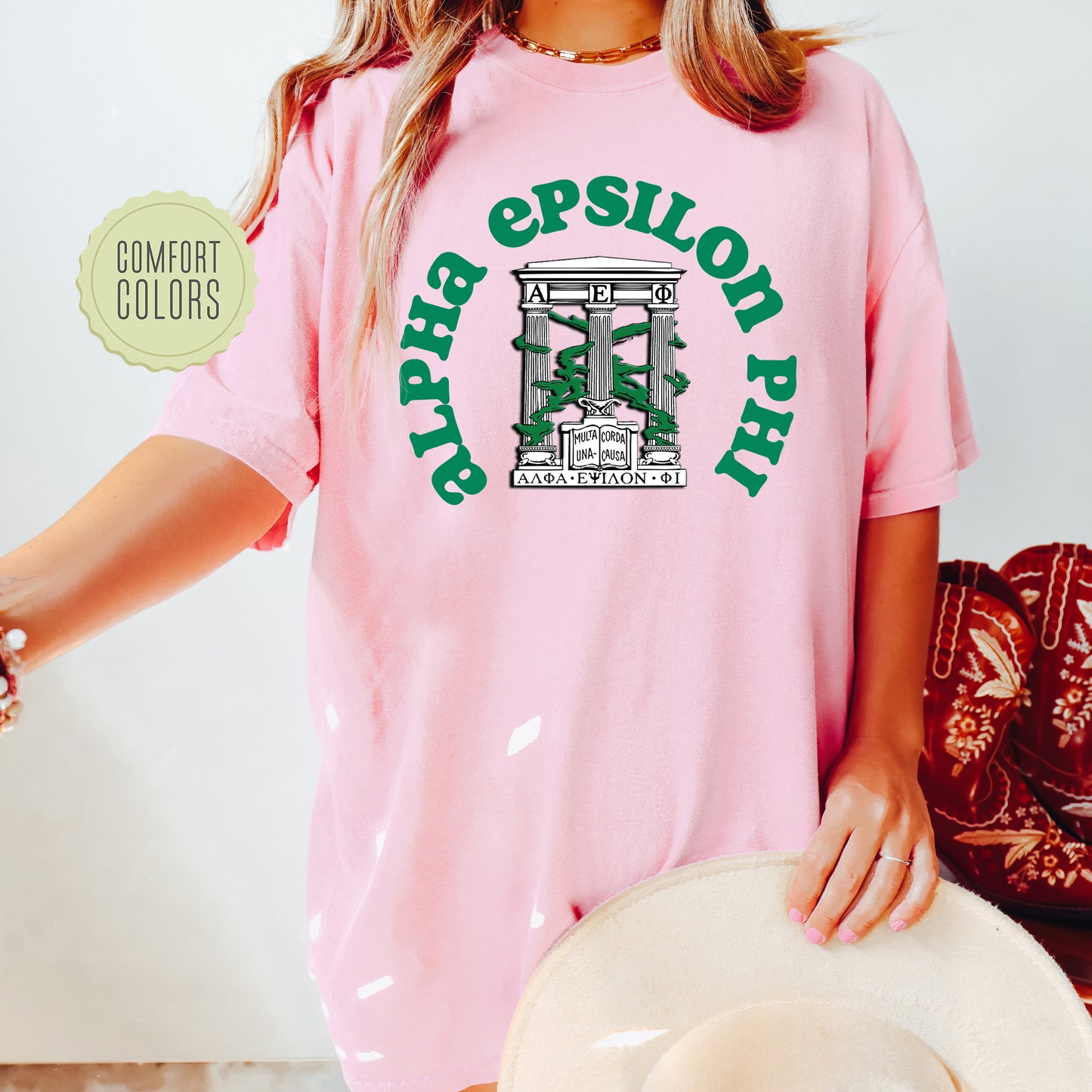a woman wearing a pink shirt and hat