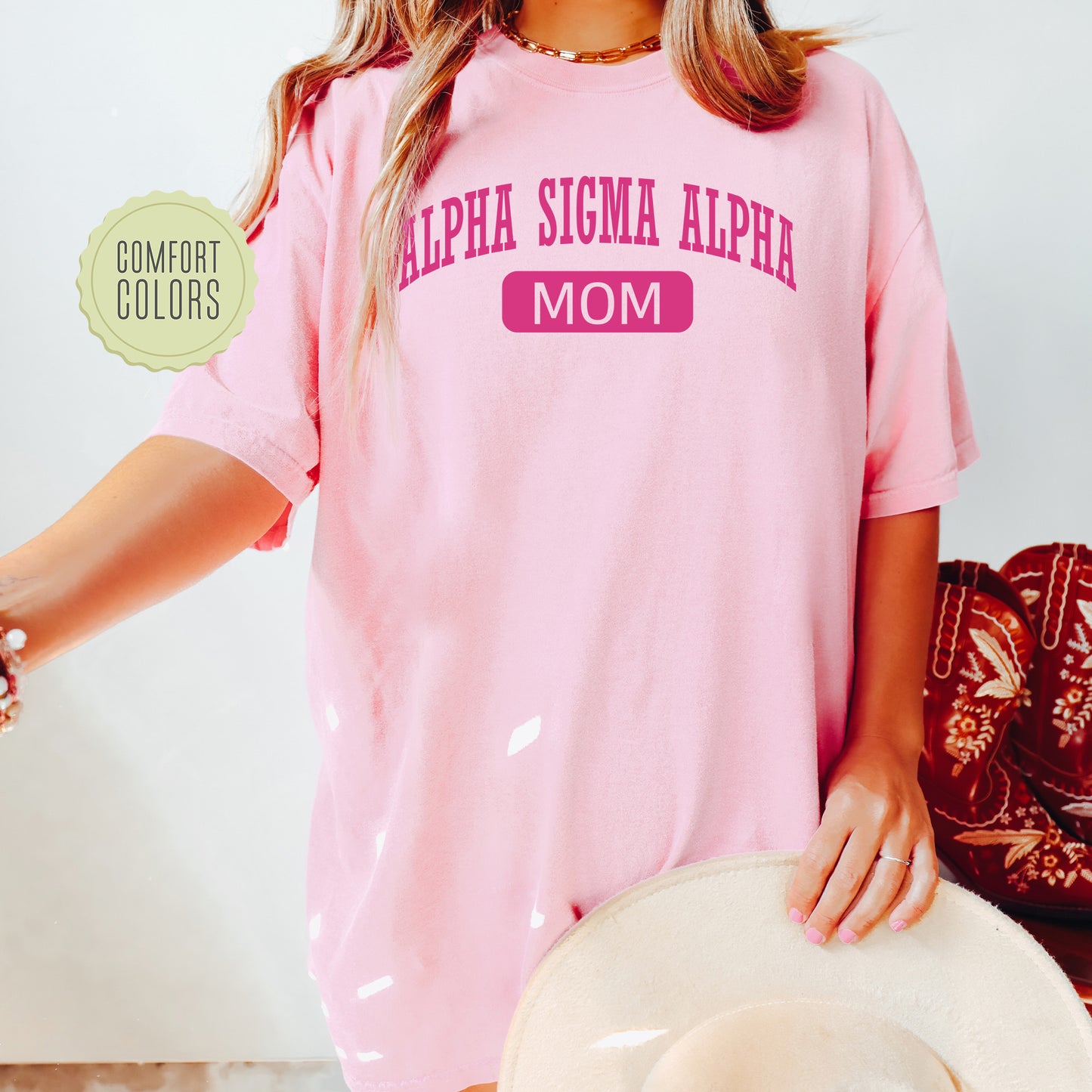 a woman wearing a pink shirt and hat