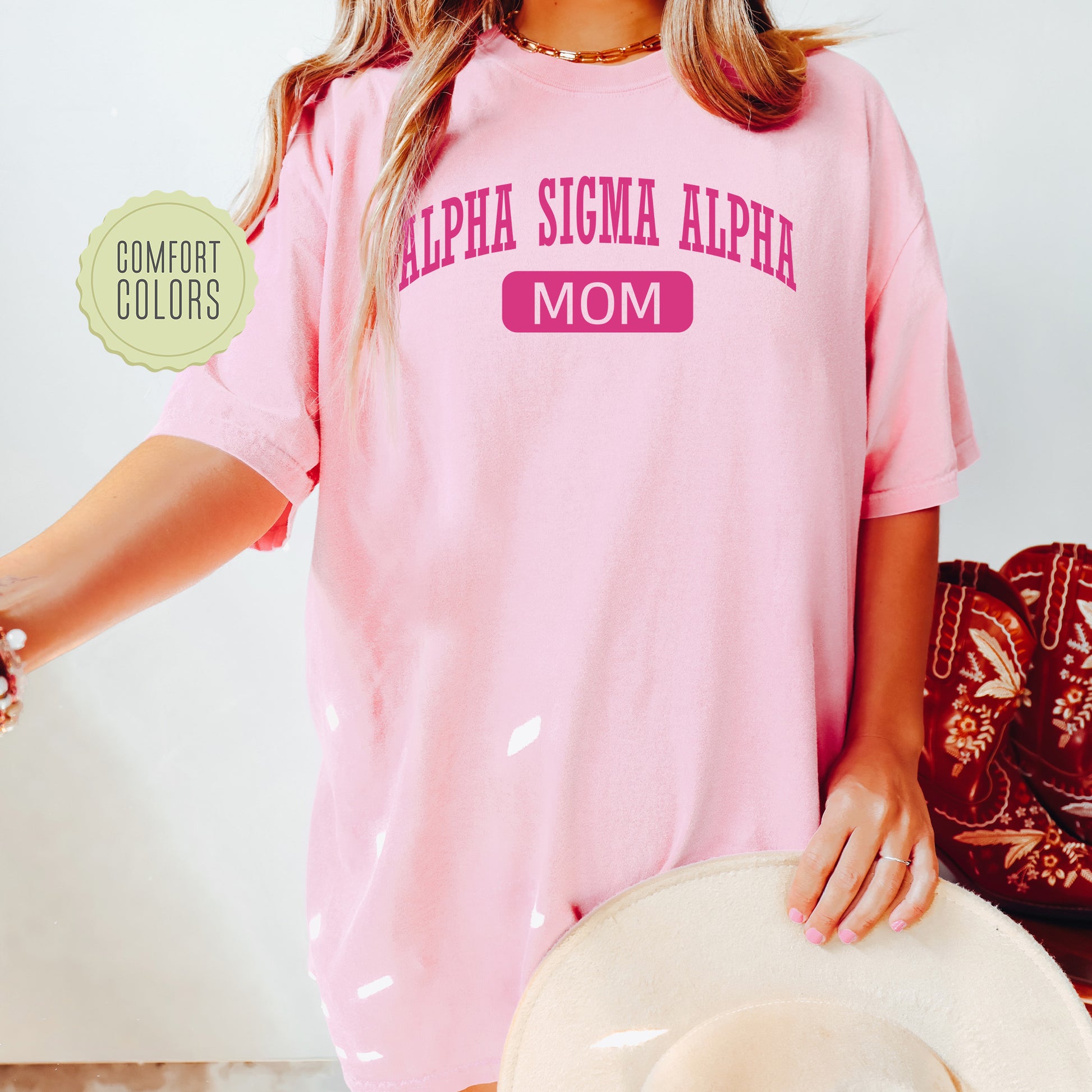 a woman wearing a pink shirt and hat