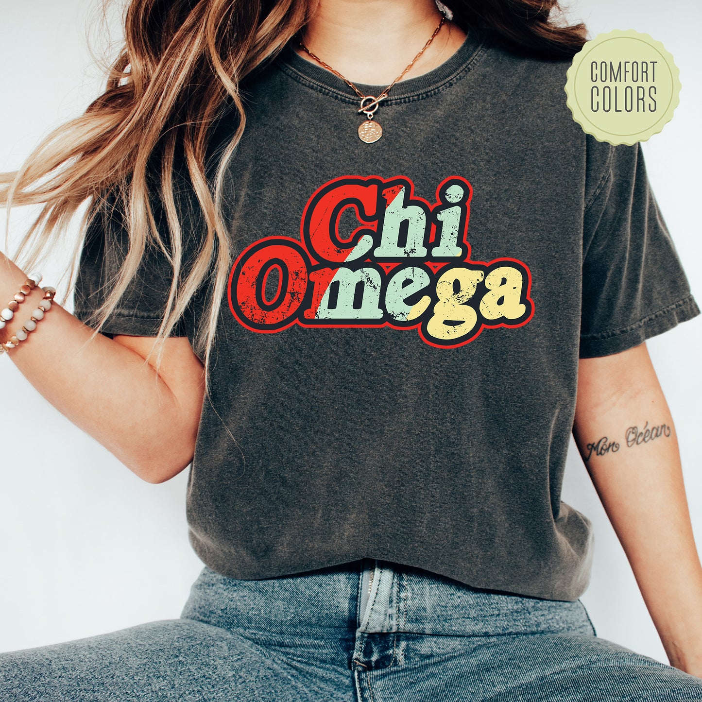 a woman wearing a shirt that says chi omega