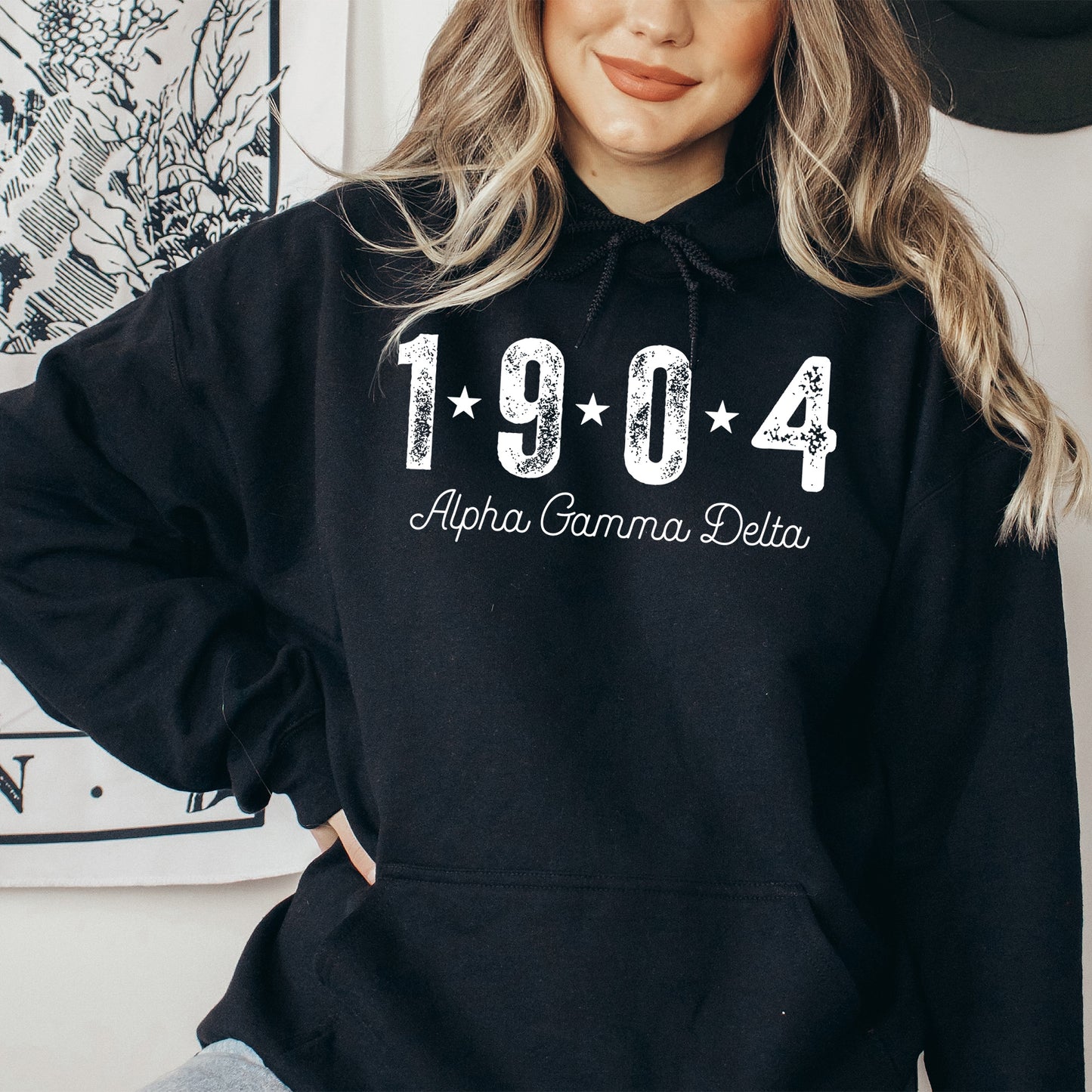 a woman wearing a black hoodie with the year 1994 printed on it
