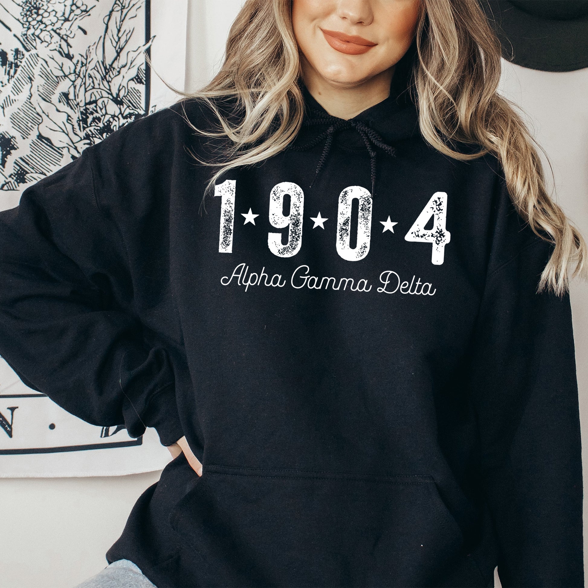 a woman wearing a black hoodie with the year 1994 printed on it