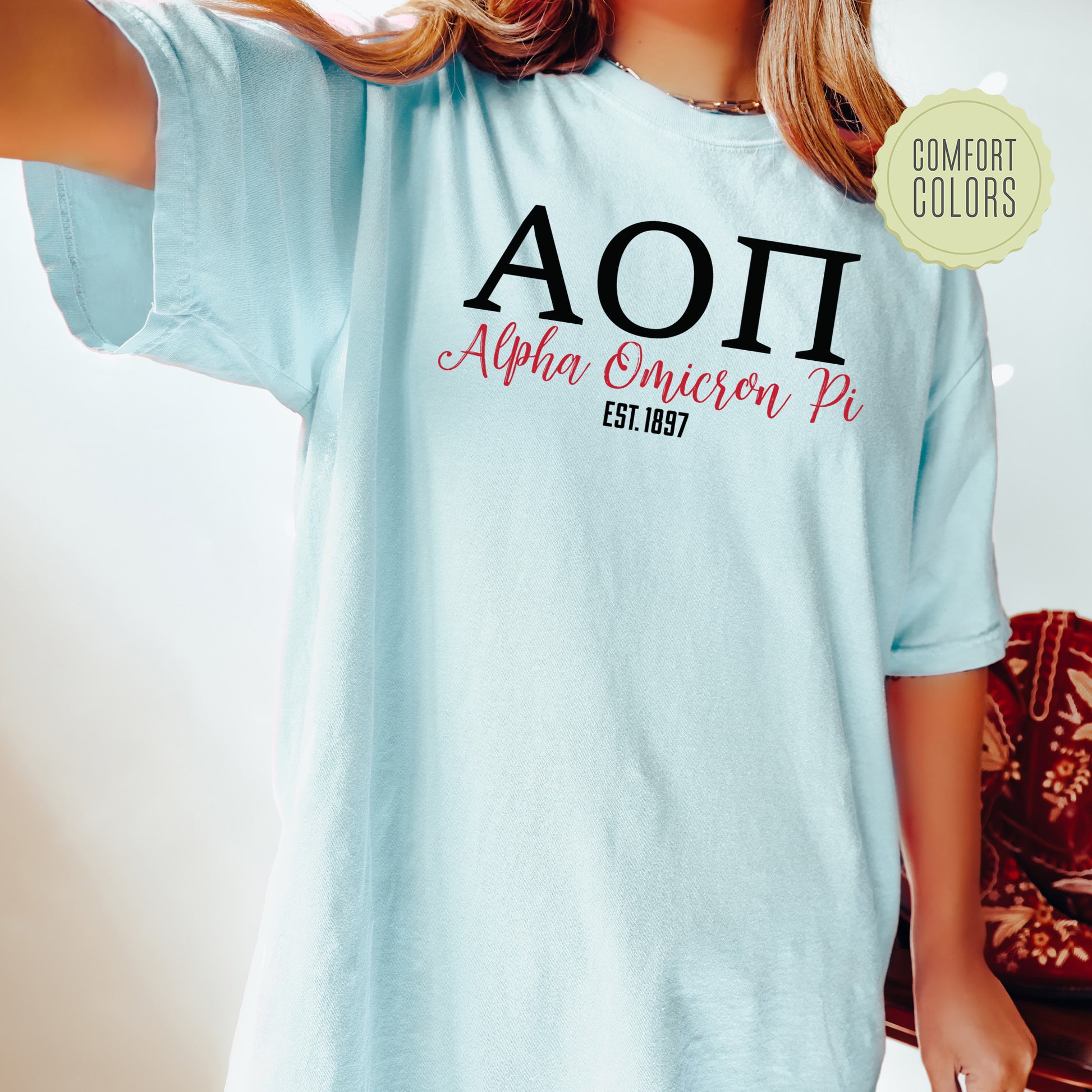 a woman wearing a light blue shirt with the word aoi on it