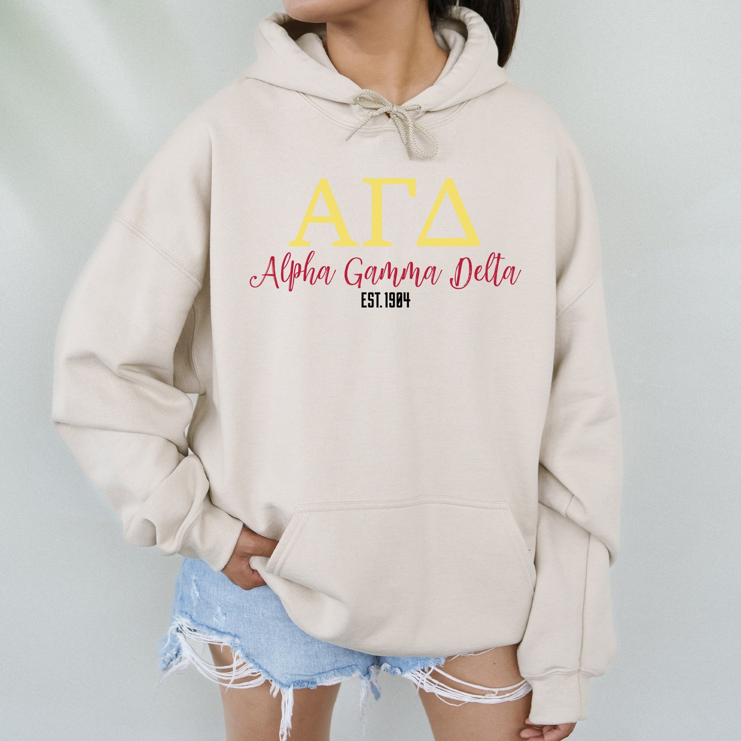 a woman wearing a hoodie with the words atta on it